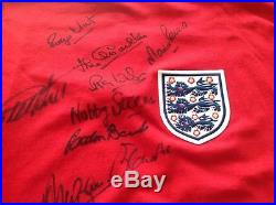 1966 team signed shirt plus bobby moore signed iconic photo