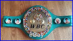 Full size WBC leather boxing belts, signed by Manny Pacquiao and Freddie Roach