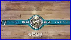 Full size WBC leather boxing belts, signed by Manny Pacquiao and Freddie Roach