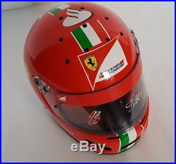 VERY RARE! Scuderia Ferrari F1 pit crew Bell helmet, signed by Vettel and Kimi